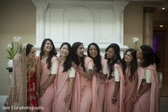 Indian bride and bridesmaids posing for pictures prior to the ceremony Indian bride and bridesmaids posing for pictures prior to the ceremony