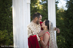 Elegant Indian couple smiles outdoors for the photo shoot. Elegant Indian couple smiles outdoors for the photo shoot.