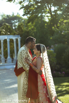 Indian groom kisses the Indian bride as the ceremony approaches. Indian groom kisses the Indian bride as the ceremony approaches.