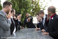 Indian groom with the groomsmen showing the wedding ring Indian groom with the groomsmen showing the wedding ring