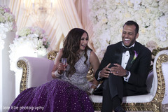 Lovely Indian newlyweds have a laugh during the reception Lovely Indian newlyweds have a laugh during the reception