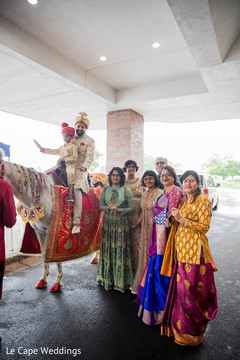 Indian groom posing with family Indian groom posing with family