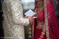Indian groom reading bride's card Indian groom reading bride's card