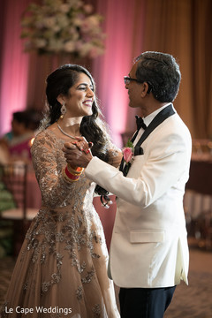 Stunning Indian bride and her father dance during the reception Stunning Indian bride and her father dance during the reception