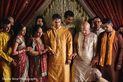 Indian wedding rituals happening as guests observe Indian wedding rituals happening as guests observe
