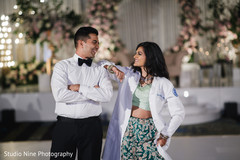 Indian newlyweds pose together as they wait for the guests to arrive Indian newlyweds pose together as they wait for the guests to arrive
