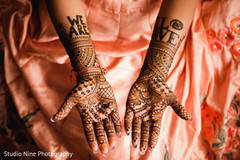 Detail of the mehndi design on the Indian bride's hands Detail of the mehndi design on the Indian bride's hands