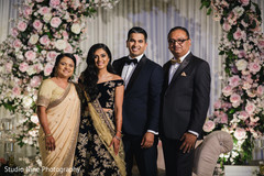 Charming family picture during the Indian wedding reception Charming family picture during the Indian wedding reception