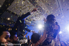 Colorful take of the Indian newlyweds having a good time during the reception Colorful take of the Indian newlyweds having a good time during the reception