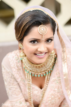Indian bride glowing in her wedding attire. Indian bride glowing in her wedding attire.