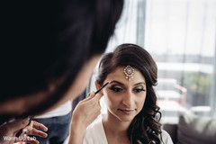 Indian bride getting her eyebrows done. Indian bride getting her eyebrows done.