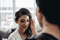 Lovely bride getting her makeup done. Lovely bride getting her makeup done.