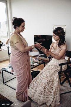 Maharani being given her bangles to put on. Maharani being given her bangles to put on.
