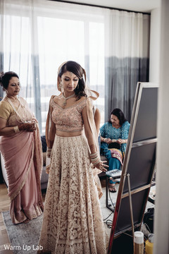 Indian bride admiring her wedding attire capture. Indian bride admiring her wedding attire capture.
