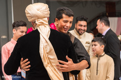 Indian wedding guests congratulating the groom Indian wedding guests congratulating the groom