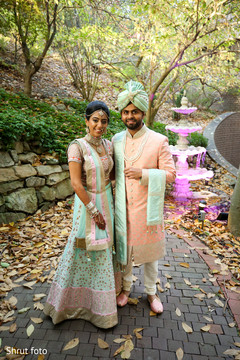 Indian bride and groom outside for pictures Indian bride and groom outside for pictures