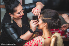 Makeup artist assisting the beautiful maharani Makeup artist assisting the beautiful maharani