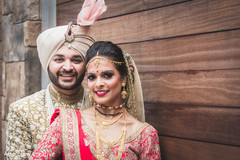 Indian bride and groom smile during the photo shoot Indian bride and groom smile during the photo shoot