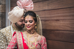 Indian groom and bride pose for pictures Indian groom and bride pose for pictures