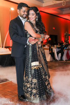 Indian newlyweds dance during the reception Indian newlyweds dance during the reception