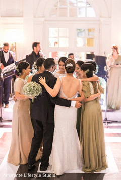 Indian couple and bridesmaids dance during the reception ceremony Indian couple and bridesmaids dance during the reception ceremony