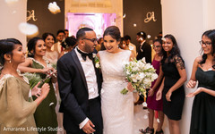 Joyful Indian newlyweds as they make their entrance Joyful Indian newlyweds as they make their entrance