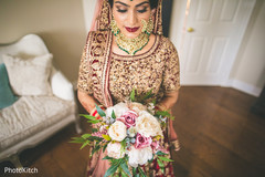 Lovely indian bride holding her bouquet Lovely indian bride holding her bouquet