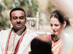 Capture of the Indian couple during the ceremony wearing the sherwani and the sari Capture of the Indian couple during the ceremony wearing the sherwani and the sari