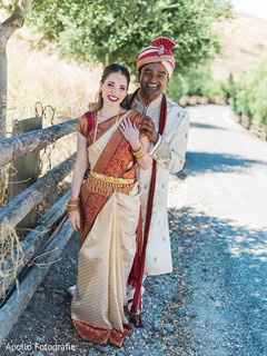 Indian newlyweds wearing the traditional wedding clothing outside Indian newlyweds wearing the traditional wedding clothing outside