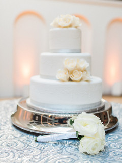 Closeup of Indian bridal bouquet next o wedding cake capture. Closeup of Indian bridal bouquet next o wedding cake capture.