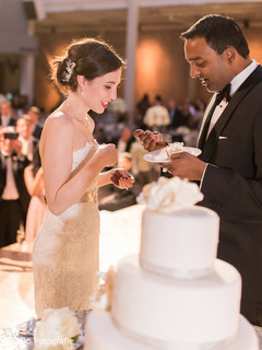 Lovely capture Indian bride and groom cutting cake together. Lovely capture Indian bride and groom cutting cake together.