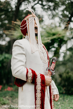 Elegant portrait of the Indian bride wearing the sherwani Elegant portrait of the Indian bride wearing the sherwani