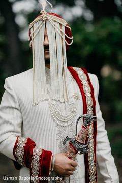Indian groom posing for pictures outdoors prior to the ceremony Indian groom posing for pictures outdoors prior to the ceremony