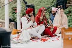 Indian bride and groom during a moment of the ceremony Indian bride and groom during a moment of the ceremony