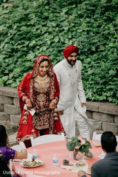 Indian wedding couple together visiting the guests tables Indian wedding couple together visiting the guests tables