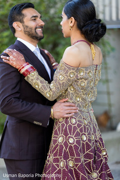Indian groom holds the beautiful maharani during the photo sessions Indian groom holds the beautiful maharani during the photo sessions