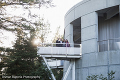 Shot of the building hosting the Indian wedding ceremony and guests Shot of the building hosting the Indian wedding ceremony and guests