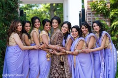 Indian bride posing with bridesmaids Indian bride posing with bridesmaids