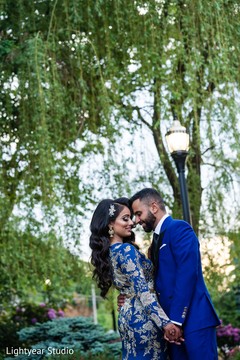 Lovely indian couple in their reception outfits Lovely indian couple in their reception outfits