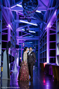 Indian newlyweds have a tender moment under the light decoration Indian newlyweds have a tender moment under the light decoration