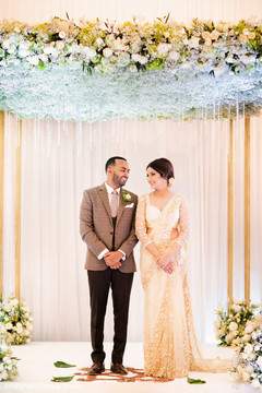 Enchanting shot of the Indian newlyweds looking at each other Enchanting shot of the Indian newlyweds looking at each other