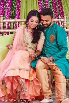 Sweet indian groom looking at bride's mehndi Sweet indian groom looking at bride's mehndi