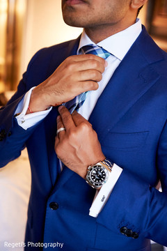 Indian groom fixing his tie Indian groom fixing his tie