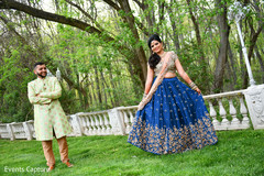 Ravishing Indian bride and grooms out in a garden capture. Ravishing Indian bride and grooms out in a garden capture.