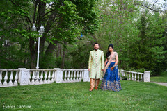 Adorable Indian couple walking holding hands. Adorable Indian couple walking holding hands.