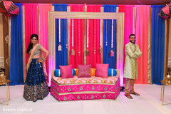 Indian bride and groom enjoying posing at the sangeet stage. Indian bride and groom enjoying posing at the sangeet stage.