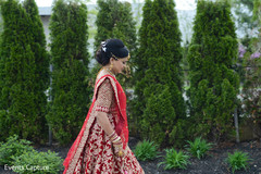 Adorable Indian bride walking outdoors. Adorable Indian bride walking outdoors.