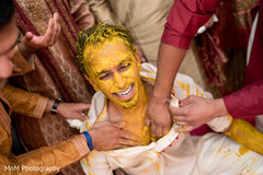 Joyful Indian groom at the pre wedding Haldi Joyful Indian groom at the pre wedding Haldi