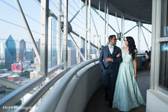 Indian couple for the photo shoop behind the city's view Indian couple for the photo shoop behind the city's view