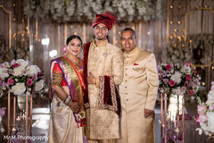 Indian groom posing with his family prior to the wedding Indian groom posing with his family prior to the wedding